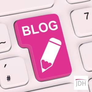 Keyboard with a pink blog key and a JDH Accounting and Business Advice Logo