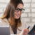 A good accountant is answering her client using different communication methods including phonecalls, text and email